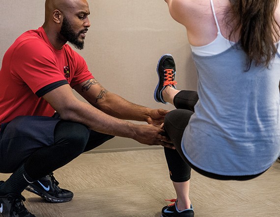 - Fitness coach training girl in blue